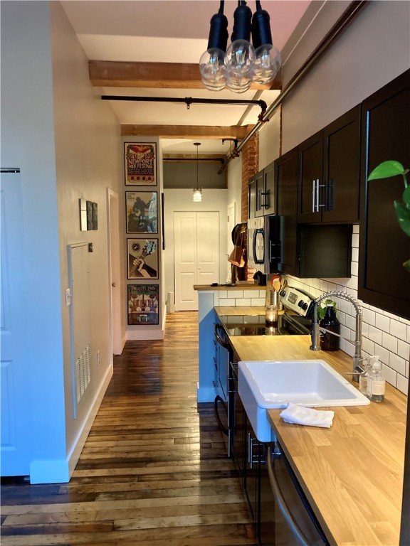 99 Allen Street, Unit 117 Woonsocket, RI 02895 - Photo 6 of 25 Looking down the hallway towards the entrance door and a hallway closet.
