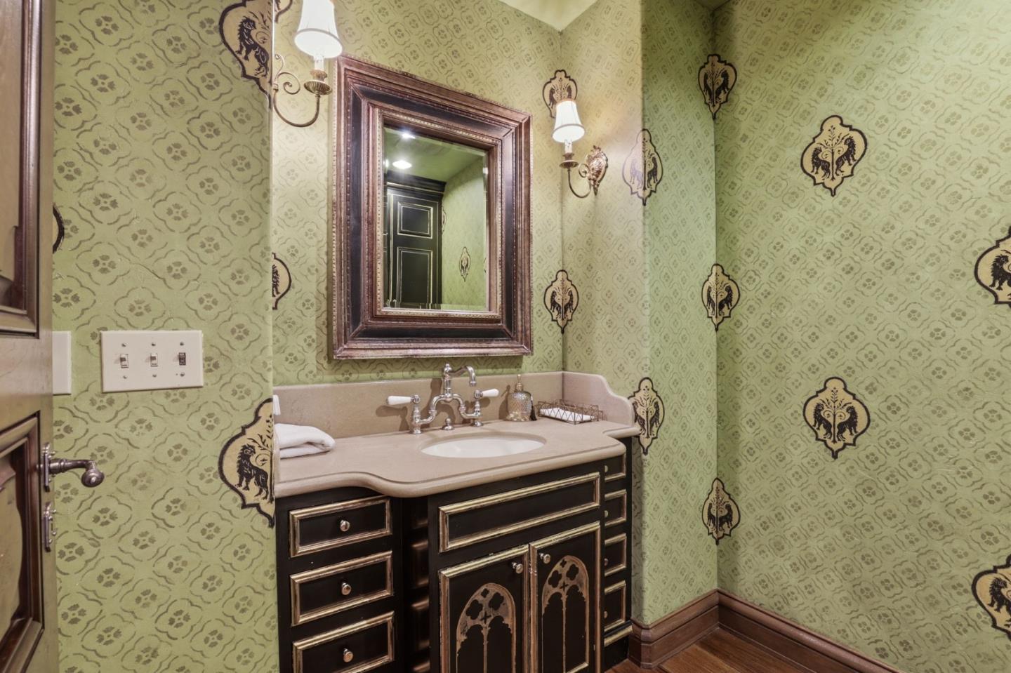 505 Gordon Avenue San Jose, CA 95127 - Photo 14 of 62 a bathroom with a sink a mirror and a shower