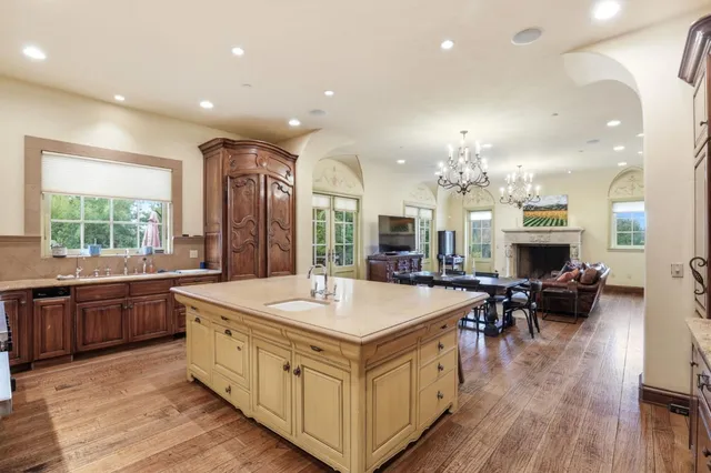 a kitchen with granite countertop stainless steel appliances and wooden cabinets