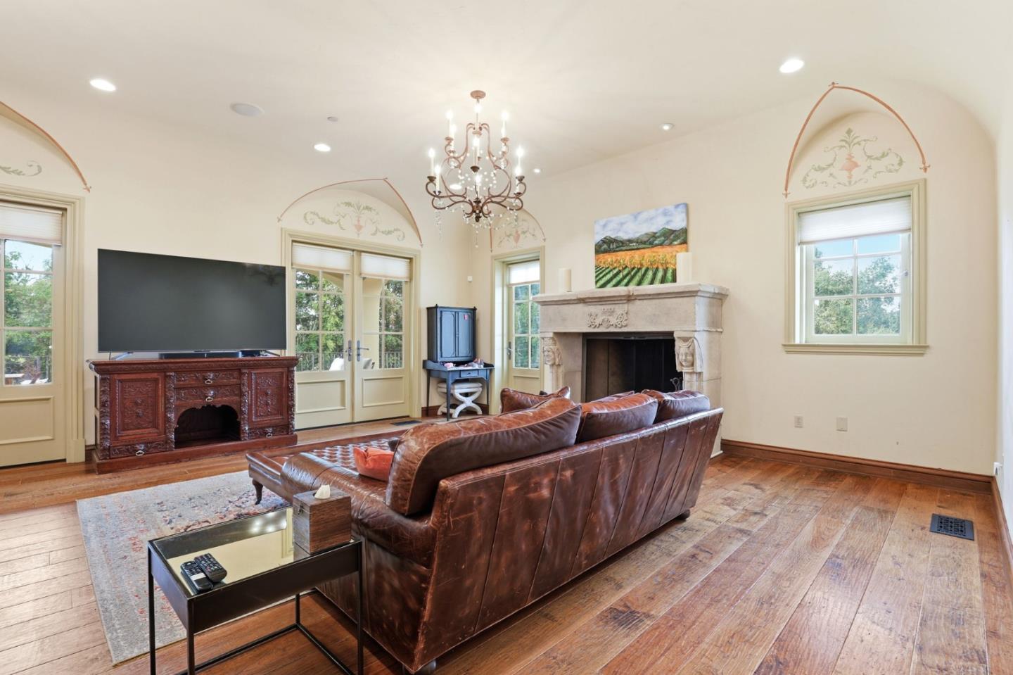 505 Gordon Avenue San Jose, CA 95127 - Photo 22 of 62 a living room with furniture a flat screen tv and a fireplace