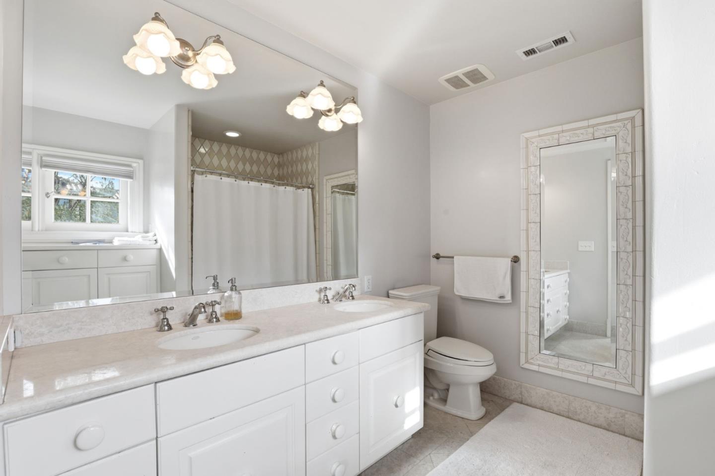 505 Gordon Avenue San Jose, CA 95127 - Photo 25 of 62 a bathroom with a double vanity sink and a toilet