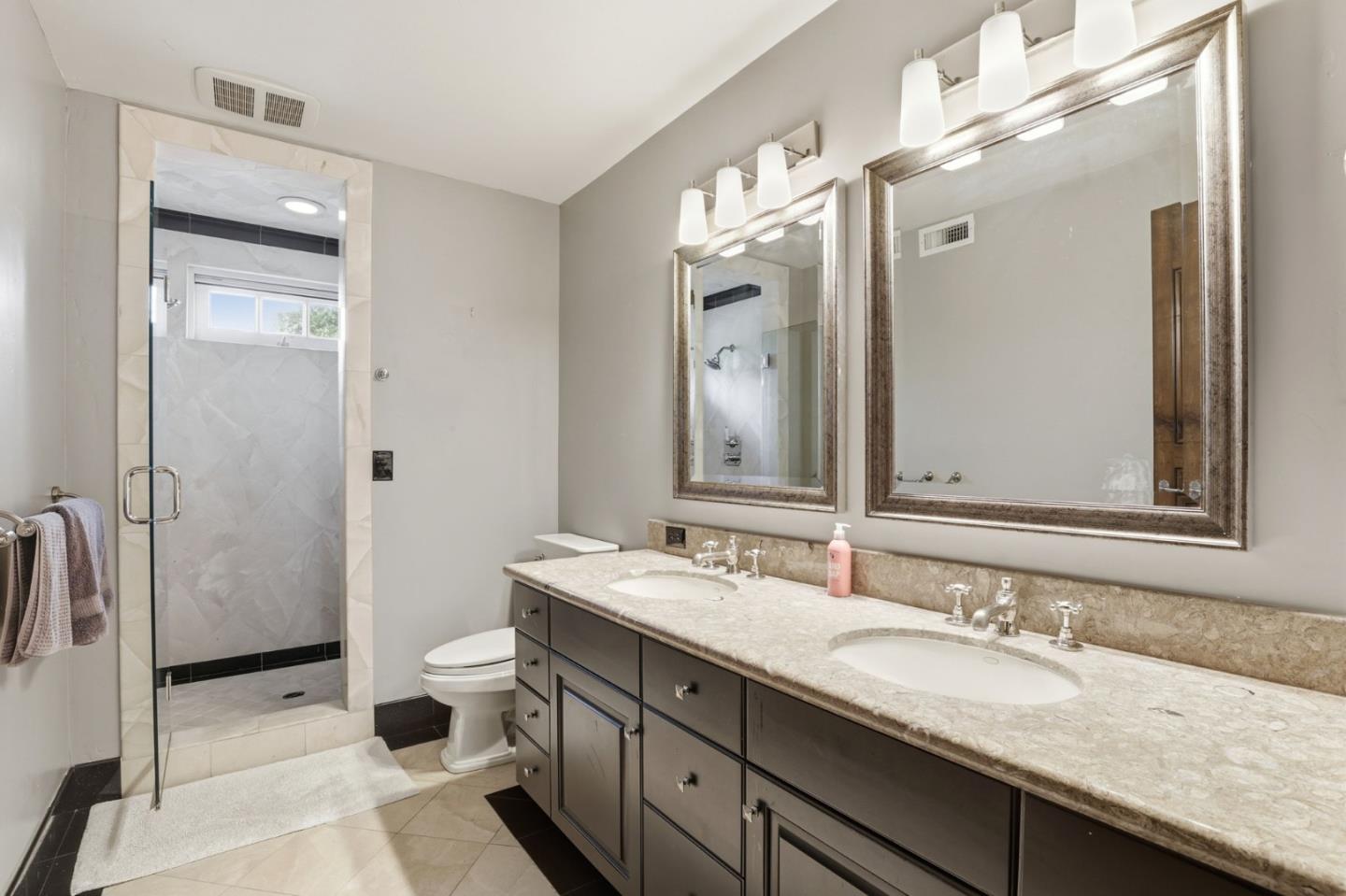 505 Gordon Avenue San Jose, CA 95127 - Photo 32 of 62 a bathroom with a granite countertop sink and a mirror