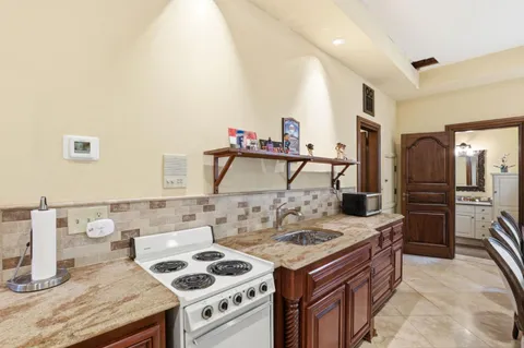 a front view of a house with a yard table and chairs