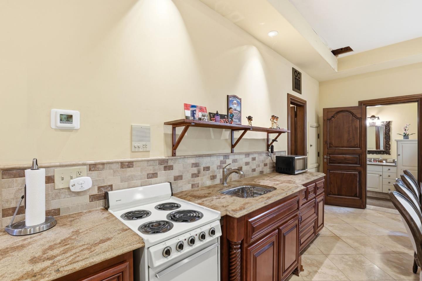 505 Gordon Avenue San Jose, CA 95127 - Photo 44 of 62 a kitchen with a stove and a refrigerator