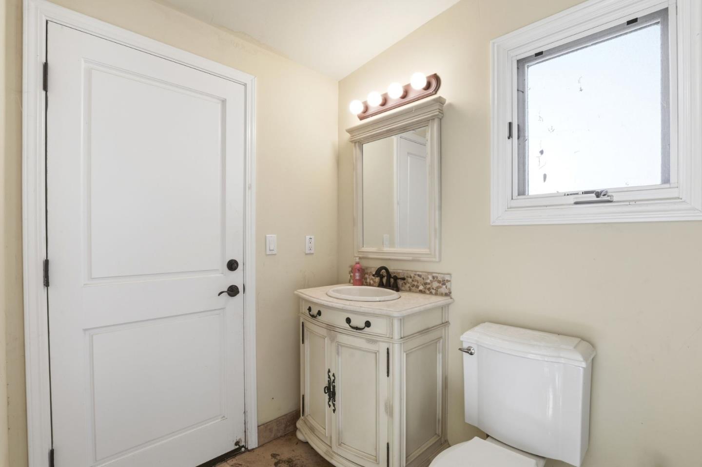 505 Gordon Avenue San Jose, CA 95127 - Photo 59 of 62 a bathroom with a toilet sink and mirror