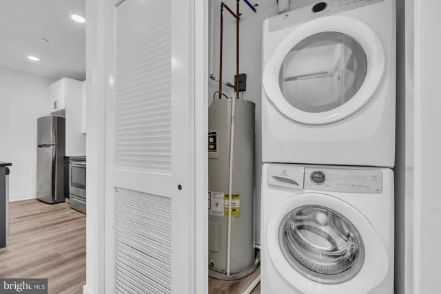 a view of a hallway with washer and dryer