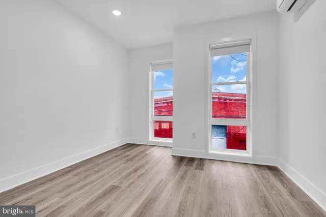 a view of an entryway with wooden floor