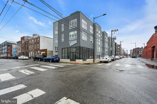 a view of a street with a building in the background