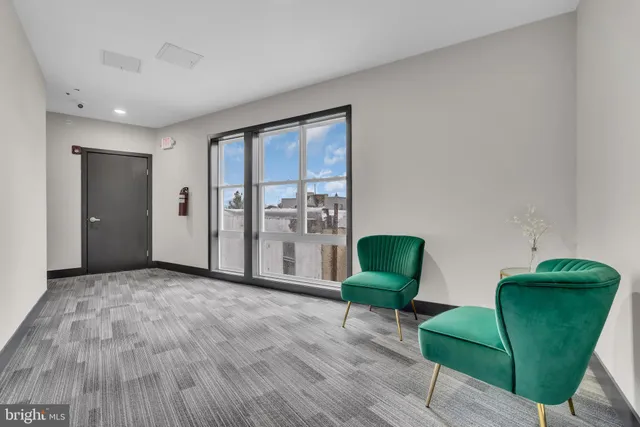 a view of a livingroom with furniture and a chair
