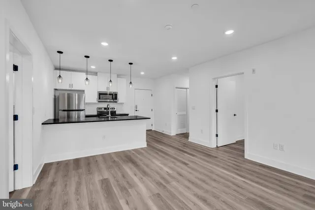 a view of kitchen with wooden floor