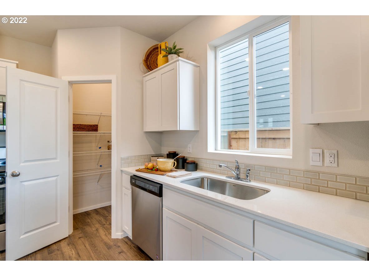 2402 Halter Drive Woodburn, OR 97071 - Photo 15 of 31 a kitchen with a sink cabinets and window