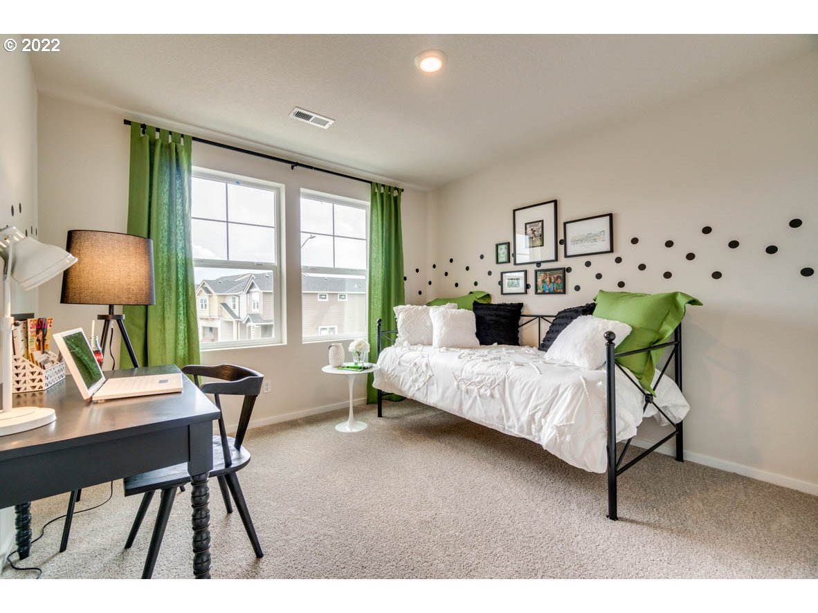 2402 Halter Drive Woodburn, OR 97071 - Photo 17 of 31 a bedroom with furniture and a window