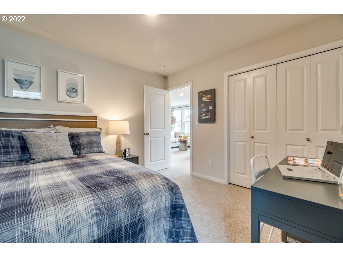 2402 Halter Drive Woodburn, OR 97071 - Photo 20 of 31 a bedroom with a bed and a cabinets