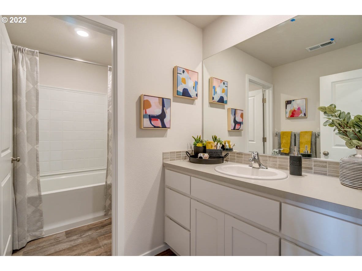 2402 Halter Drive Woodburn, OR 97071 - Photo 27 of 31 a bathroom with a sink and a mirror