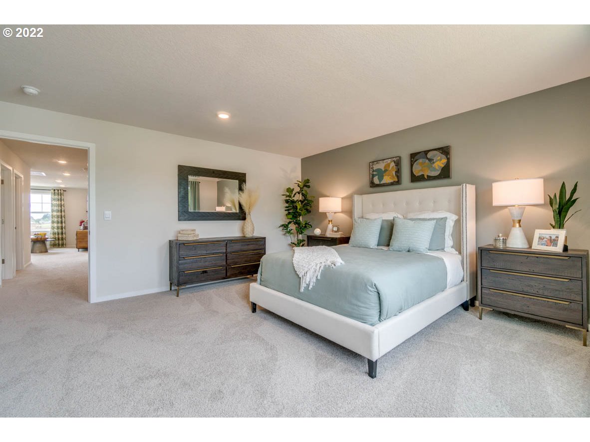 2402 Halter Drive Woodburn, OR 97071 - Photo 29 of 31 a spacious bedroom with a bed and window