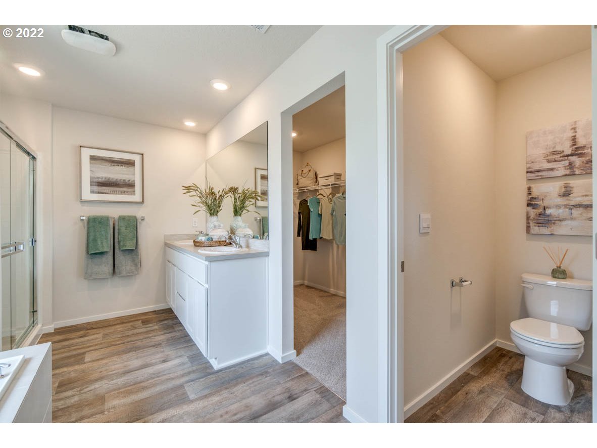 2402 Halter Drive Woodburn, OR 97071 - Photo 31 of 31 a bathroom with a sink a toilet and shower