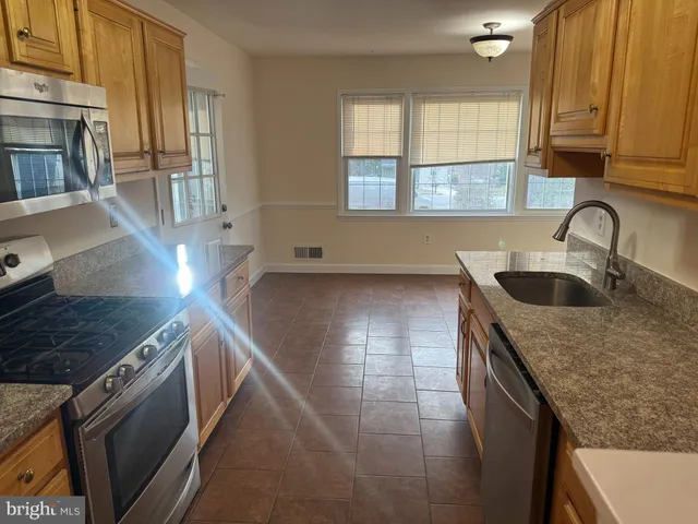 a view of balcony with wooden floor and outdoor seating