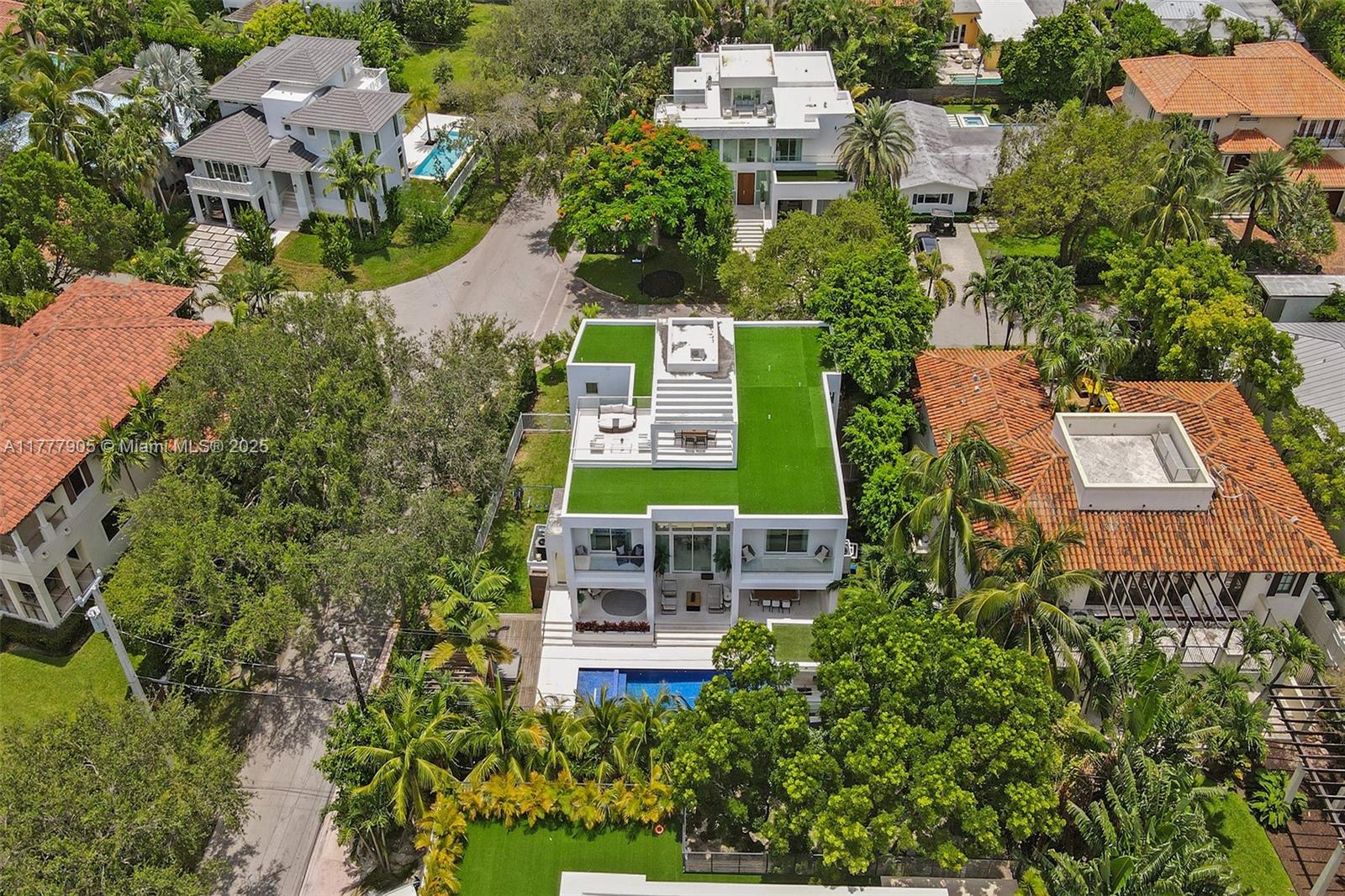 201 Buttonwood Drive Key Biscayne, FL 33149 - Photo 11 of 80 an aerial view of a house with garden space and street view