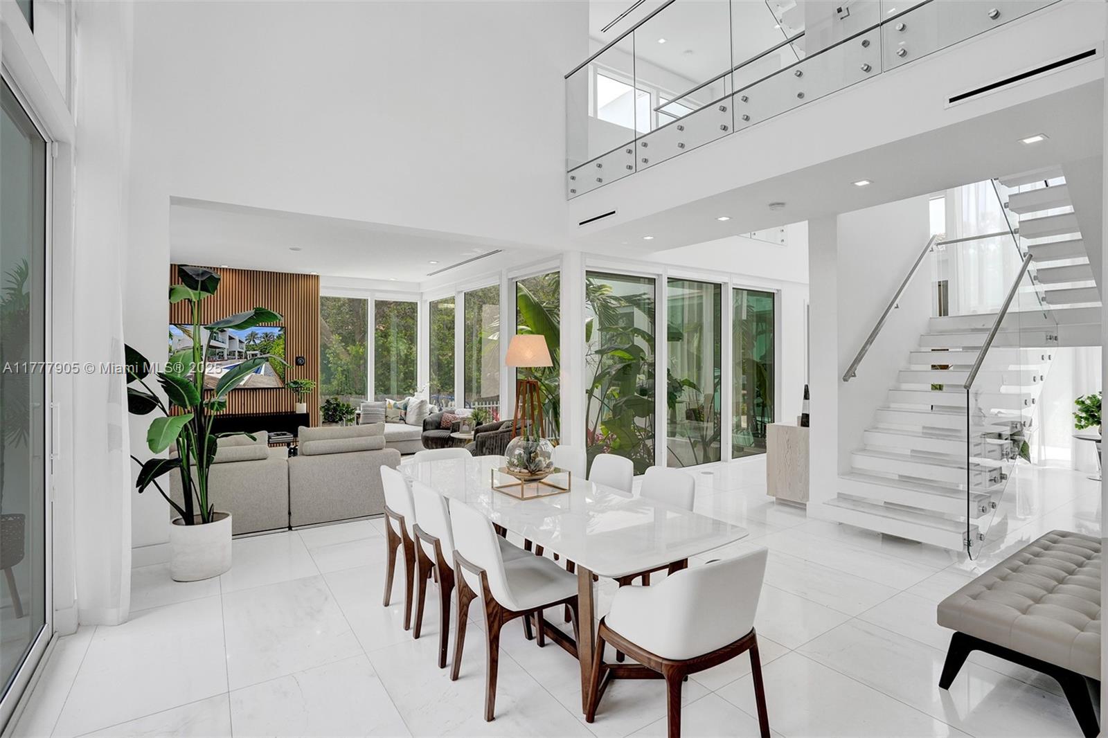 201 Buttonwood Drive Key Biscayne, FL 33149 - Photo 14 of 80 a view of a dining room with furniture window and wooden floor