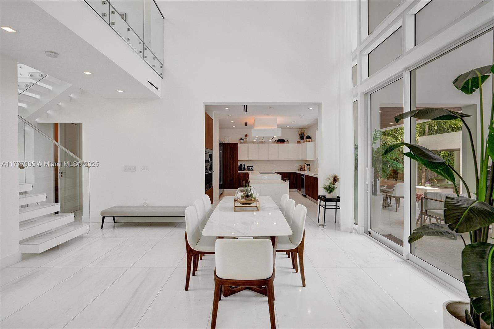 201 Buttonwood Drive Key Biscayne, FL 33149 - Photo 16 of 80 a dining room with furniture and wooden floor