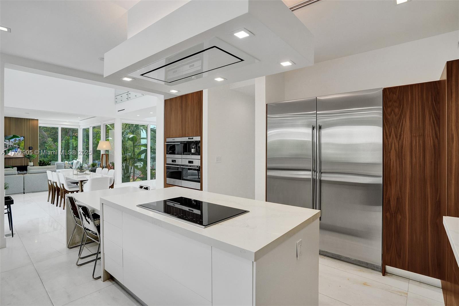 201 Buttonwood Drive Key Biscayne, FL 33149 - Photo 18 of 80 a kitchen with a refrigerator a sink and a stove top oven