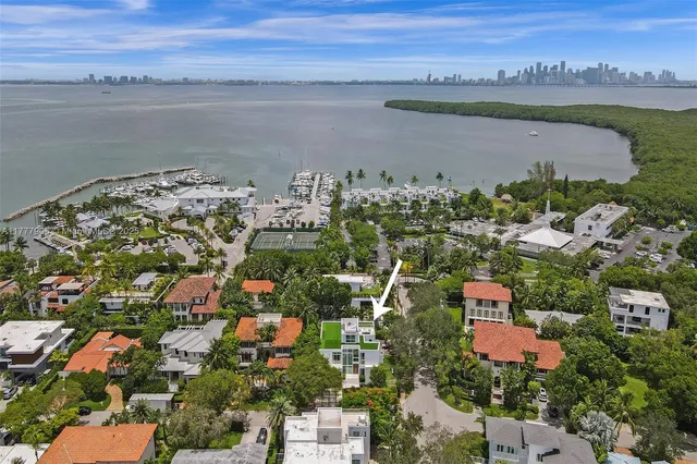 an aerial view of a house with a yard