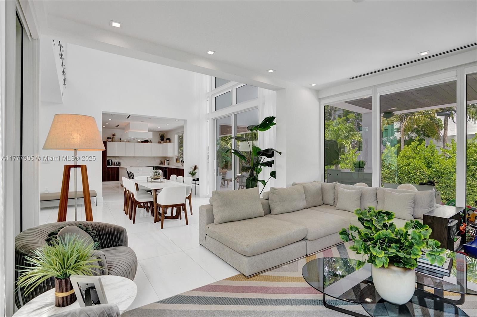 201 Buttonwood Drive Key Biscayne, FL 33149 - Photo 21 of 80 a living room with furniture potted plant and a large window