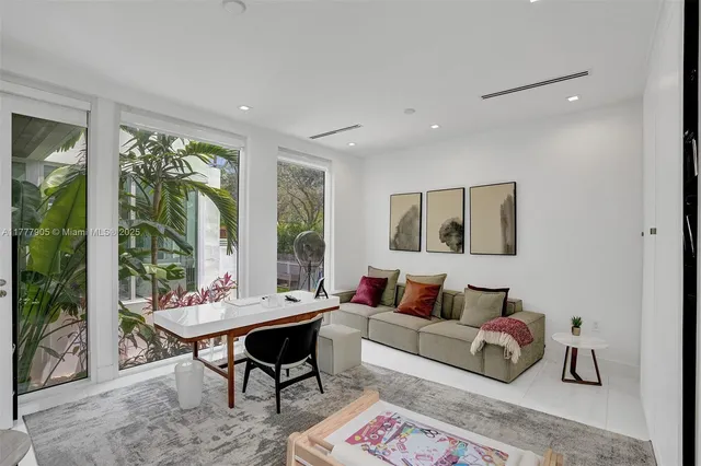 a spacious bedroom with a bed and a couch