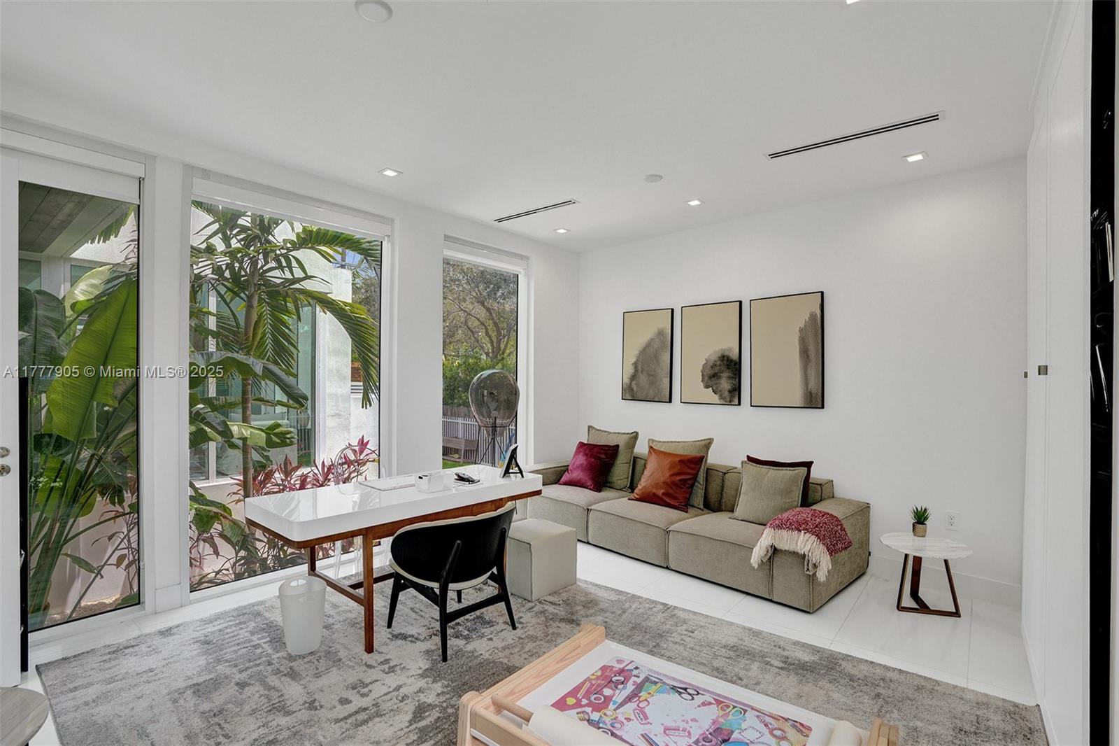 201 Buttonwood Drive Key Biscayne, FL 33149 - Photo 22 of 80 a living room with furniture and a large window