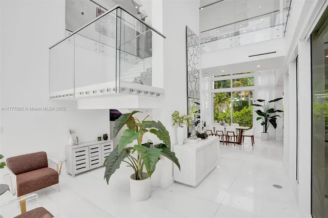a bathroom with a glass door shower and a sink