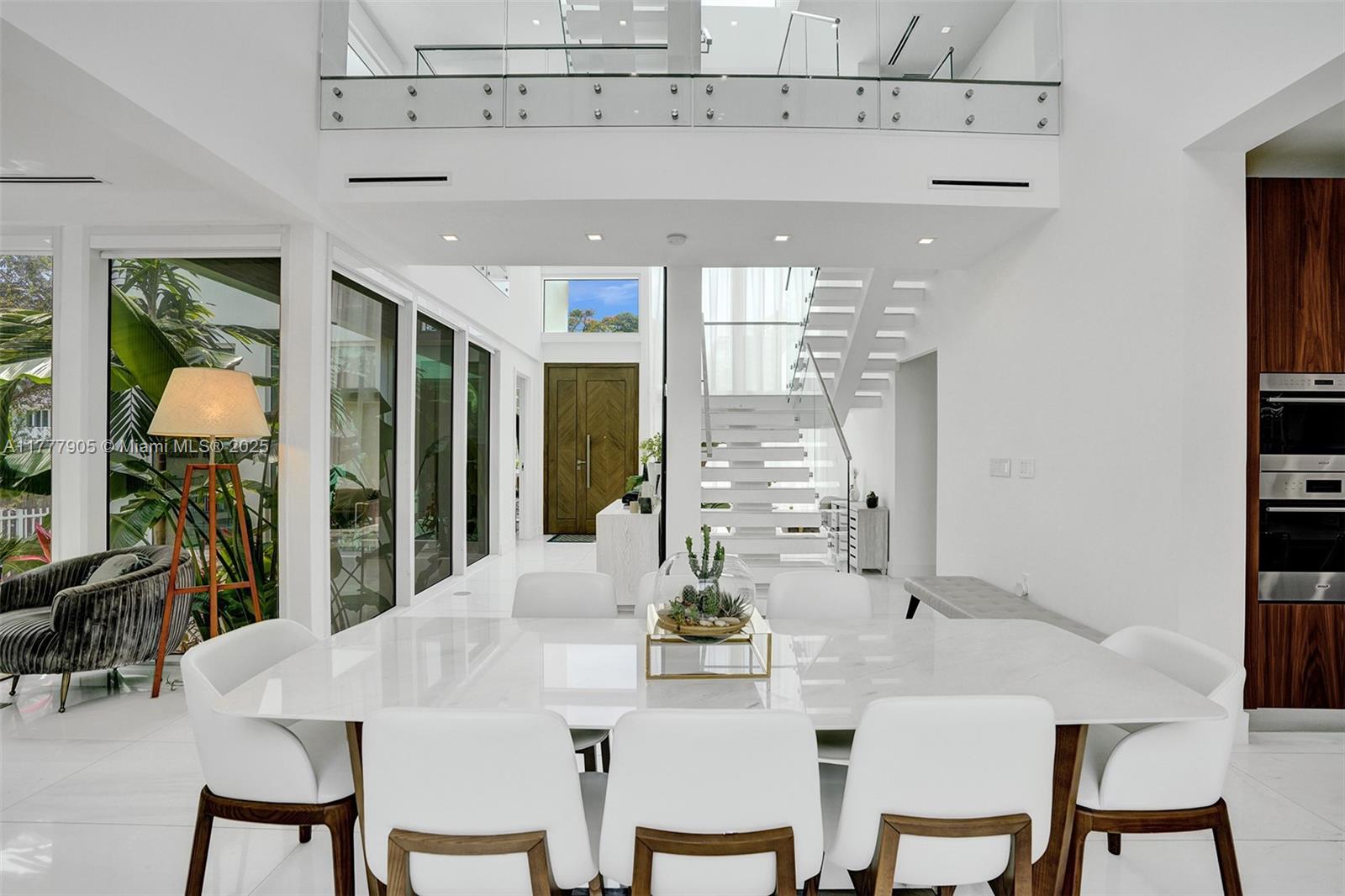 201 Buttonwood Drive Key Biscayne, FL 33149 - Photo 26 of 80 a view of a dining room with furniture window and outside view