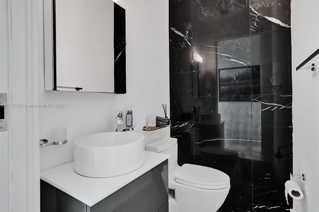 a view of entryway with wooden floor and stairs