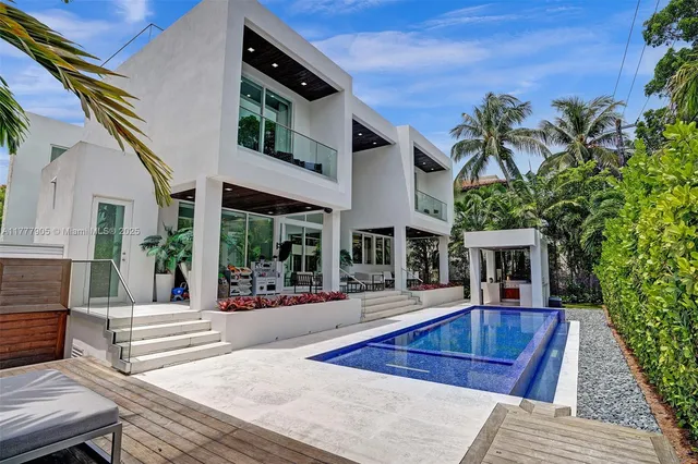 a view of a garden with a building in the background