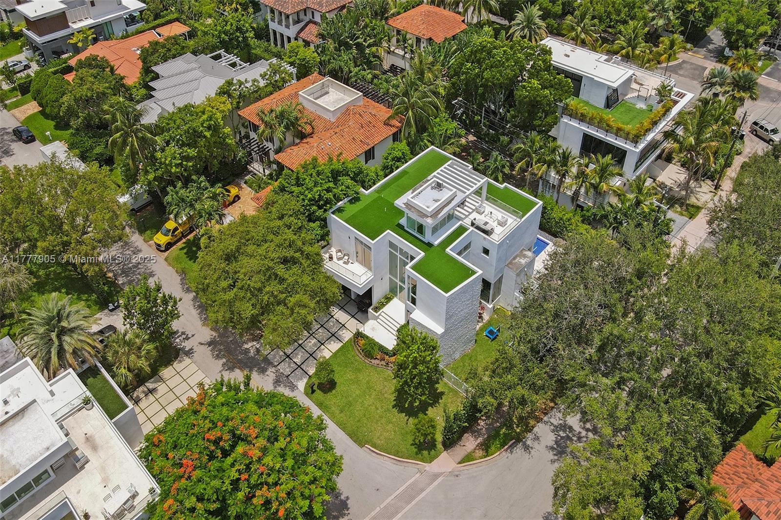 201 Buttonwood Drive Key Biscayne, FL 33149 - Photo 3 of 80 an aerial view of a house with a yard