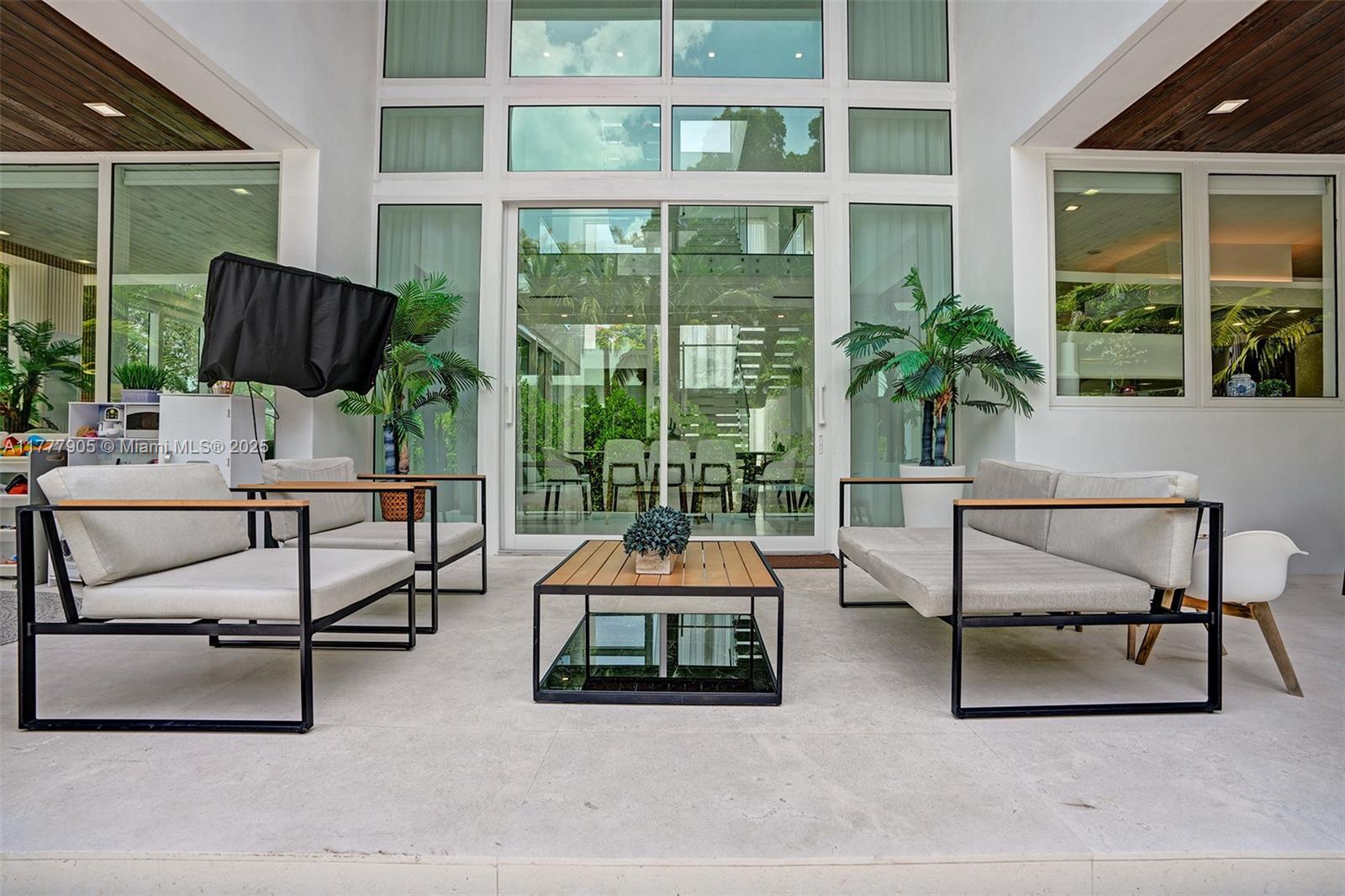 201 Buttonwood Drive Key Biscayne, FL 33149 - Photo 34 of 80 a outdoor space with a couch and a potted plant