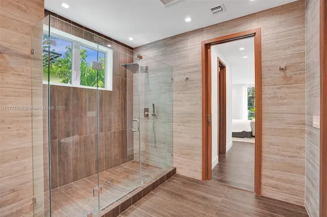 a view of a patio with couches potted plants and a big yard