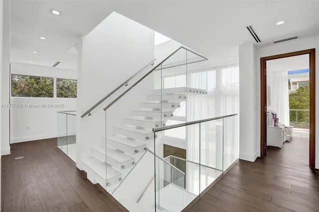a view of a storage and utility room with washer and dryer
