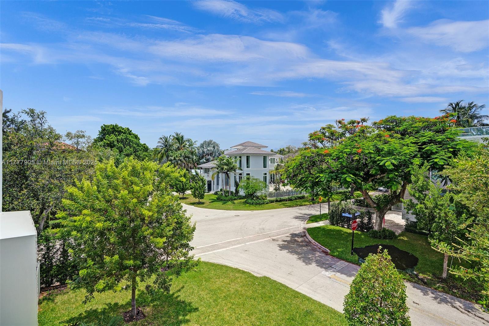 201 Buttonwood Drive Key Biscayne, FL 33149 - Photo 50 of 80 a view of a yard with flower plants and wooden fence