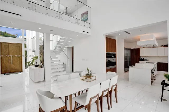 a kitchen with stainless steel appliances a sink stove and cabinets
