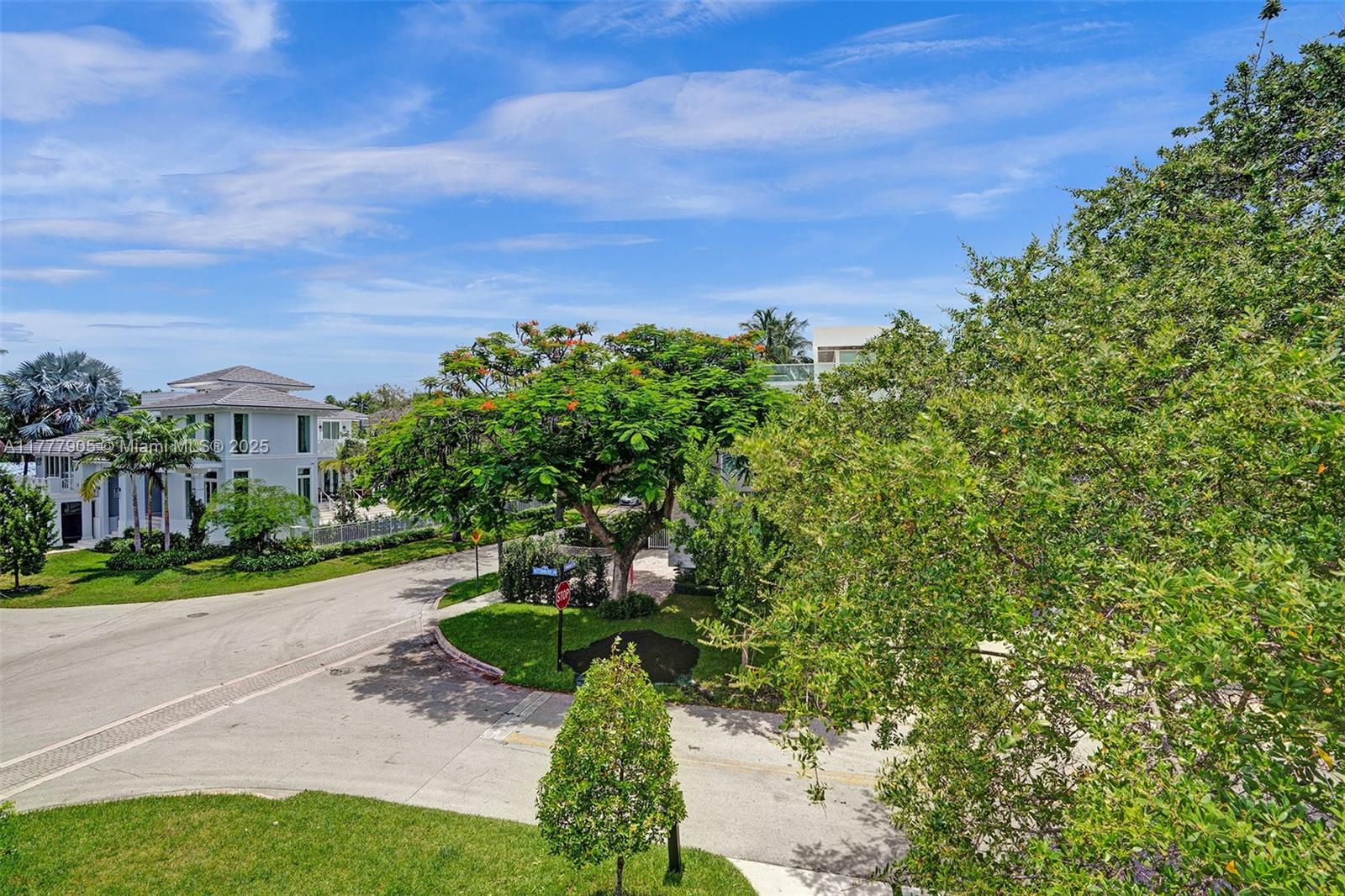 201 Buttonwood Drive Key Biscayne, FL 33149 - Photo 51 of 80 a view of a garden with a building in the background
