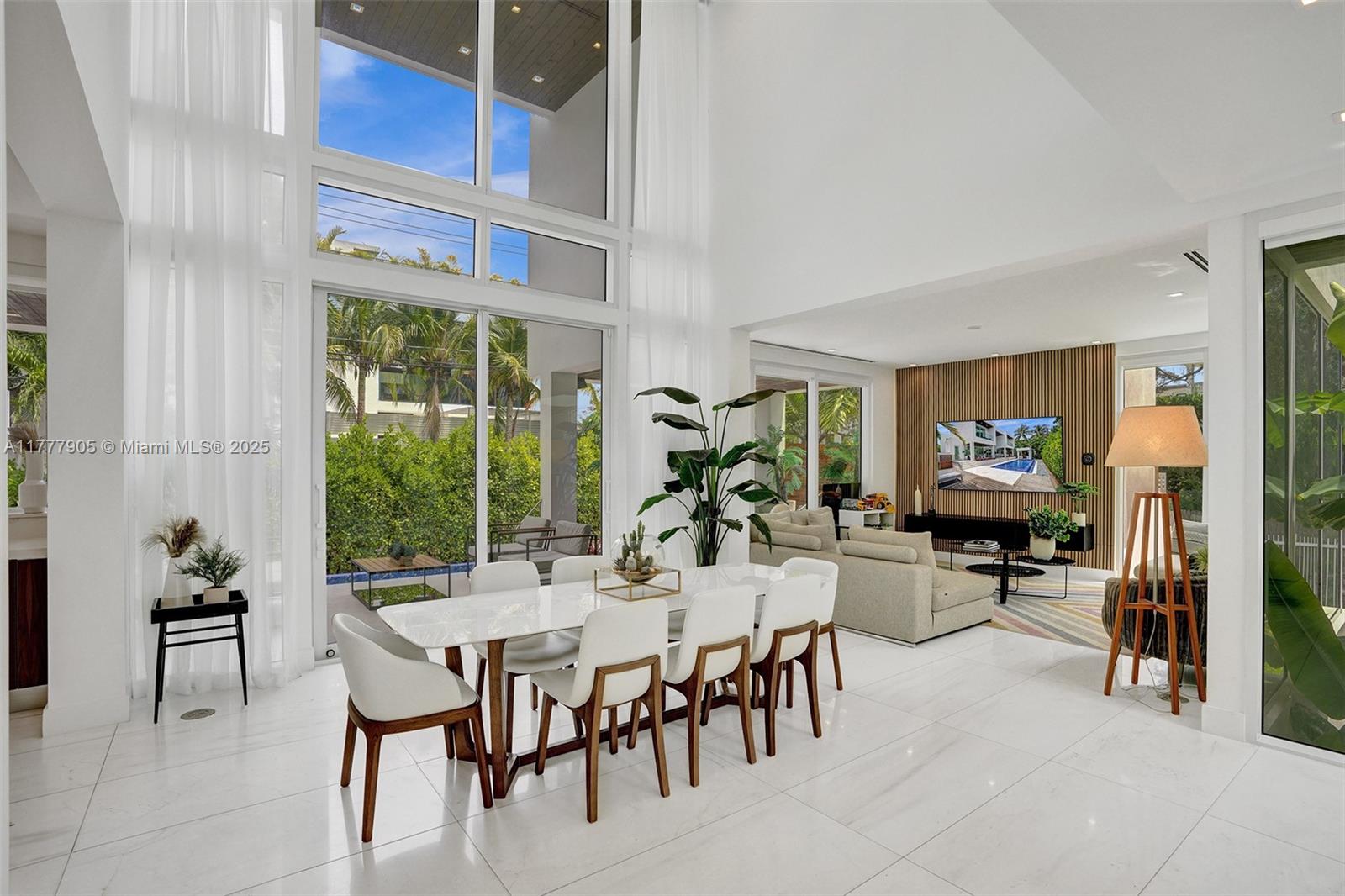 201 Buttonwood Drive Key Biscayne, FL 33149 - Photo 6 of 80 a view of a dining room with furniture window and outside view