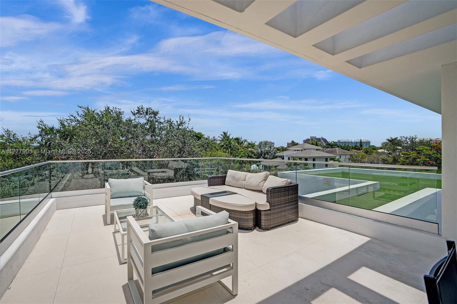 201 Buttonwood Drive Key Biscayne, FL 33149 - Photo 63 of 80 a view of a terrace with couches and city view