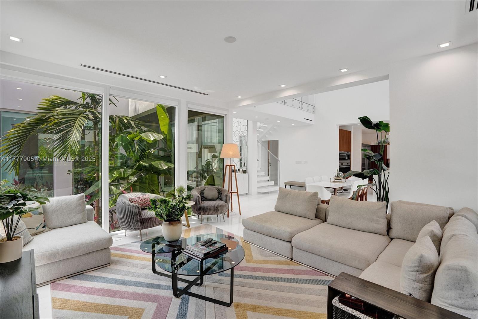 201 Buttonwood Drive Key Biscayne, FL 33149 - Photo 66 of 80 a living room with furniture and a large window