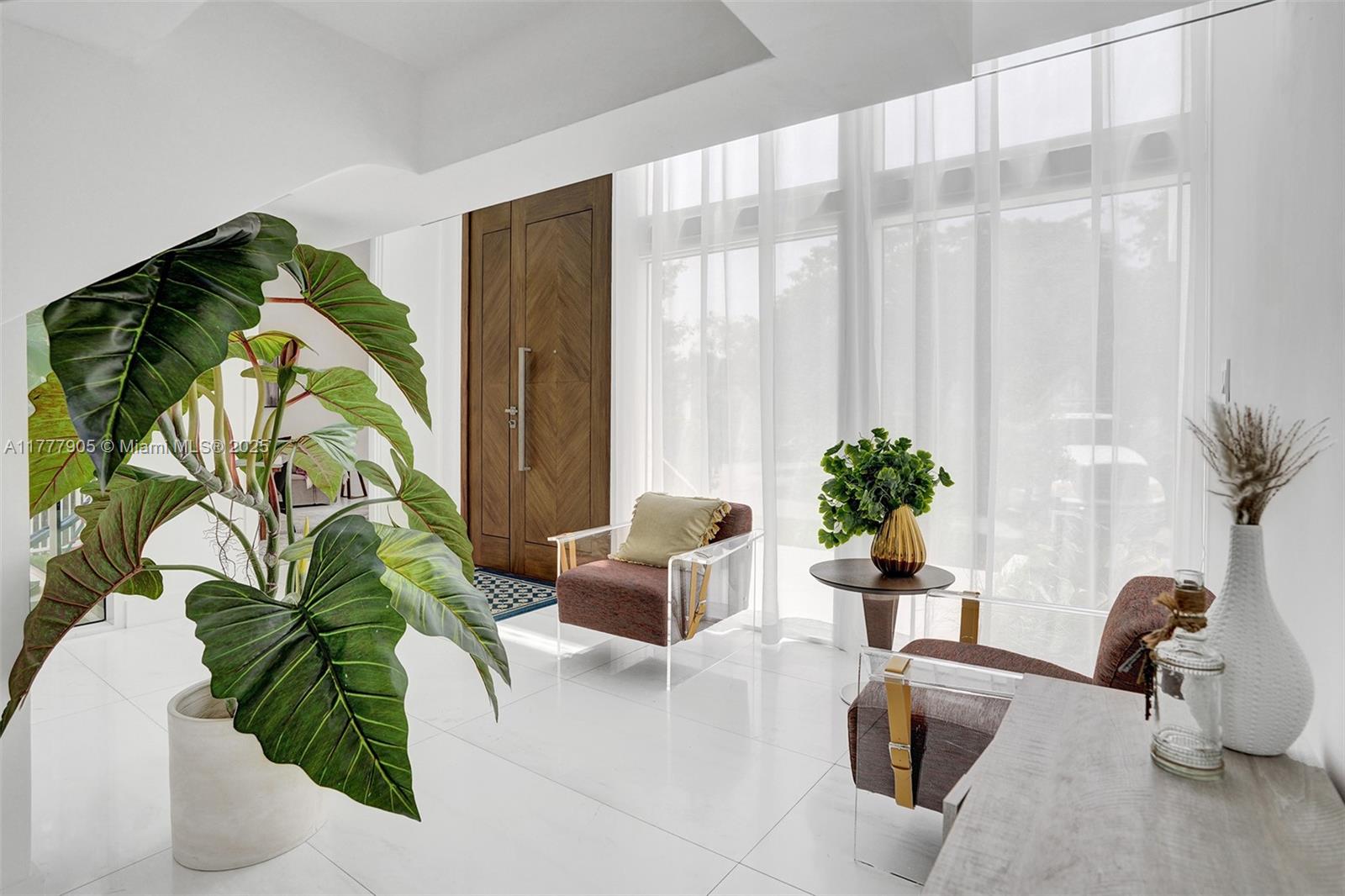 201 Buttonwood Drive Key Biscayne, FL 33149 - Photo 72 of 80 a living room with furniture and a potted plant