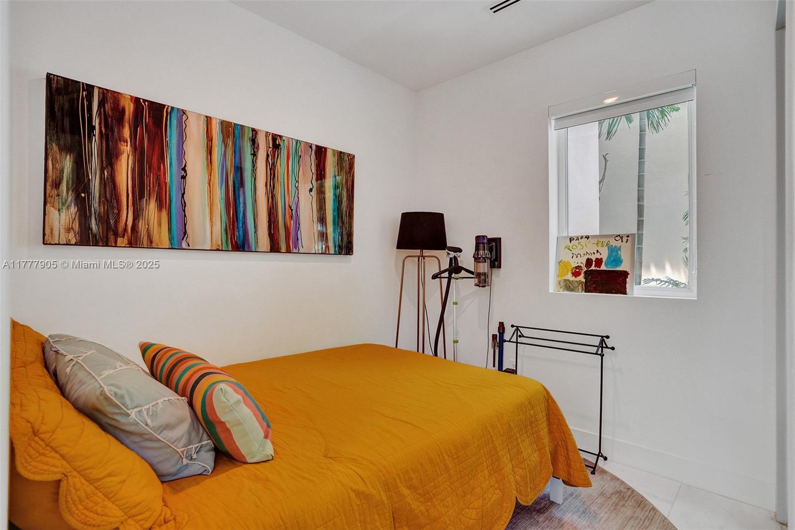 201 Buttonwood Drive Key Biscayne, FL 33149 - Photo 74 of 80 a bedroom with a bed and wooden floor