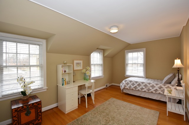 1130 Raleigh Road Glenview, IL 60025 - Photo 17 of 25 a bedroom with a bed and large windows