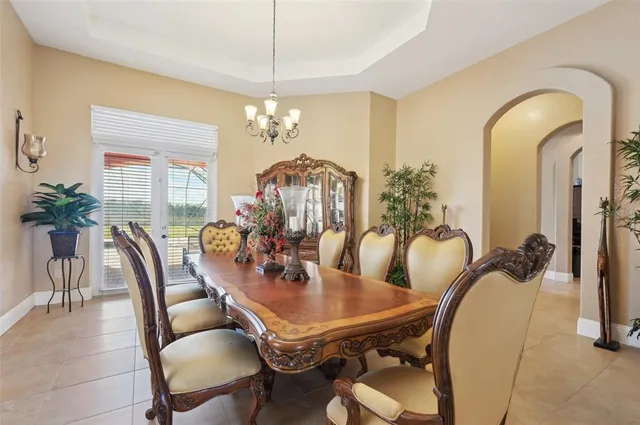 a kitchen with stainless steel appliances granite countertop wooden cabinets a stove a sink and dishwasher