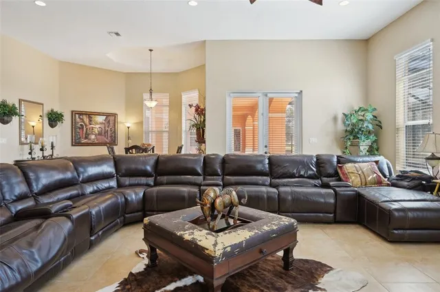 a bedroom with 2 bed and a chandelier