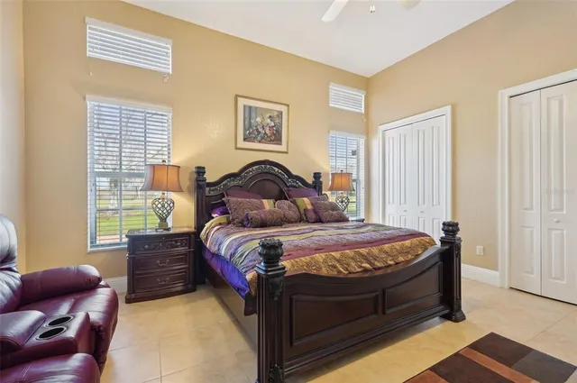 a living room with furniture a table and a chandelier