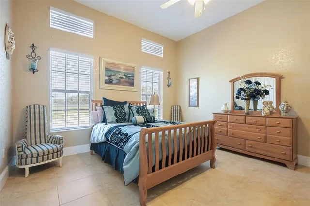 an aerial view of residential houses with outdoor space and ocean view